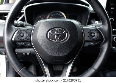 Vinnytsia, Ukraine; July 08, 2022. Close up Toyota Corolla steering wheel. Toyota Corolla interior. Toyota Corolla dashboard.
