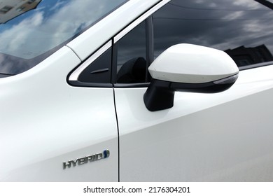 Vinnytsia, Ukraine; July 08, 2022. Toyota Corolla Hybrid rear view mirror. White Toyota Corolla mirror.