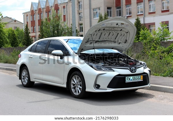 Vinnytsia, Ukraine; July 08, 2022. Toyota Corolla\
open hood. Broken engine Toyota Corolla with the hood up. Toyota\
Corolla engine.