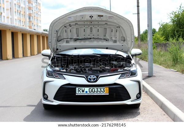 Vinnytsia, Ukraine; July 08, 2022. Toyota Corolla\
open hood. Broken engine Toyota Corolla with the hood up. Toyota\
Corolla engine. Front\
view.