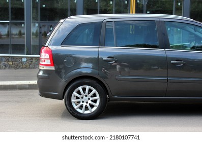 Vinnytsia, Ukraine; July 16, 2022. Grey Opel Zafira Rear Right Side Of The Car. German Minivan Opel Zafira At The Parking. Side View.