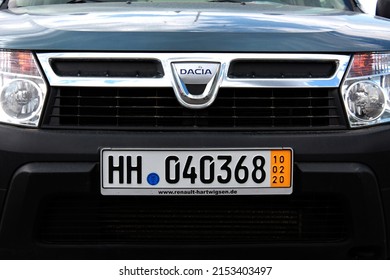 Vinnytsia, Ukraine; May 02, 2022. Dacia Duster Logo. Dacia Duster Emblem. Dacia Duster Radiator Grille. Dacia Duster Front Bumper. Front Of The Car. German License Plate On The Bumper Of A Car