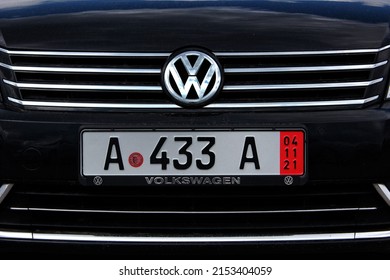 Vinnytsia, Ukraine; May 02, 2022. Volkswagen Touran Logo And Emblem. Volkswagen Touran Radiator Grille. Volkswagen Touran Front Bumper. Front Of The Car. German License Plate On The Bumper