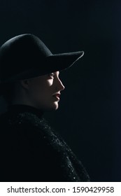 Vintage 1940s Woman In Black Hat. Side View.