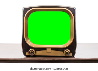 Vintage 1950s television on table isolated on white with chroma key green screen and clipping path.