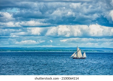 Vintage, 3 Mast Big Sailing Vessel At Sea On A Murky Day With Clouds. The Old Sailing Ship In The Ocean Conveys A Sense Of Adventure And Discovery. Illustration For Land Of Opportunity, New Horizons