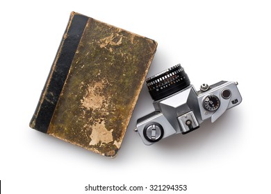 The Vintage 35mm Film Camera And Old Book