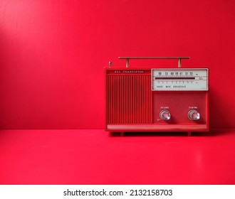 Vintage 50s Transistor Radio, Red Wall Background, Listen Music Concept