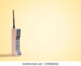 Vintage 80's Mobile Phone on yellow retro background with space for copy and text