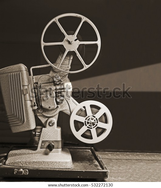 Vintage 8mm home movie projector and film cans isolated on white Stock  Photo - Alamy