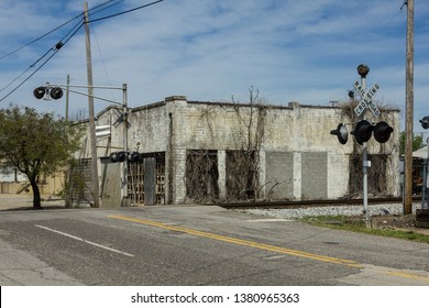 Vintage Abandoned Building Near Railroad Tracks In The Deep South Of Birmingham Alabama With Cloudy Sky