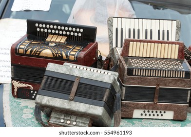 Vintage Accordion. A Portable Musical Instrument With Metal Reeds Blown By Bellows, Played By Means Of Keys And Buttons.