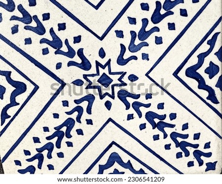 Vintage and aged blue ceramic tiles background, Abstract floral and geometric pattern texture, Outdoor building block wall, Can be used as a background to display or montage your products.
