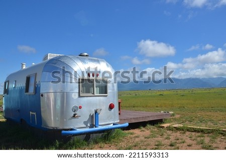 vintage airstream trailer in scenic landscape