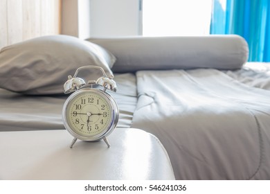 Vintage Alarm Clock And Bed