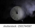 ** Vintage Alarm Clock at Midnight in Mysterious Smoky Atmosphere