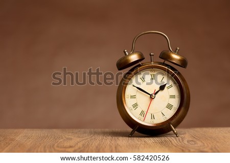 vintage alarm clock on table