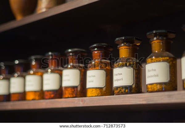 Vintage alchemy chemistry workshop rack shelf\
and glass vials\
ingredients