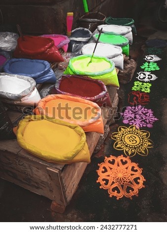 Vintage allure captured in a street market in India, featuring vibrant rangoli colors neatly displayed. An evocative snapshot of traditional craftsmanship and cultural vibrancy.