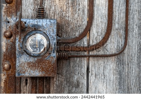 Vintage Ampere meter, Ampere meter older on wooden wall background, rusty on Retro Ampere meter, power supply A monitor vintage background.