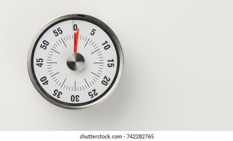 Vintage Analog Kitchen Countdown Timer With Classical Clock Face And Red Remaining Time Display, 1 Minute Left, Close Up Shot With Copy Space