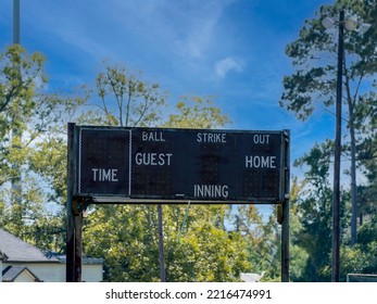 Vintage Analog Scoreboard At A Little League Baseball Playing Field.