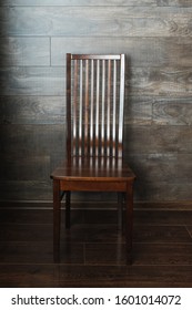 Vintage Antique Brown High Back Chair On Wooden Background.