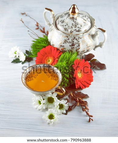 Similar – Cup with acacia blossoms Tea with spoon and honey