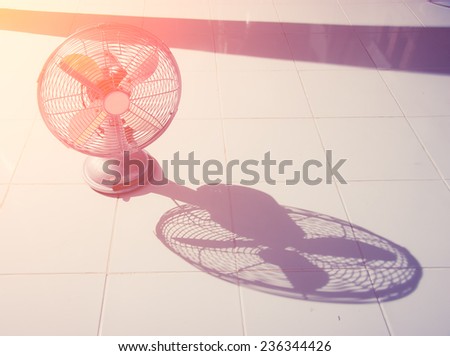 vintage Antique fan and shadow on tiled floor