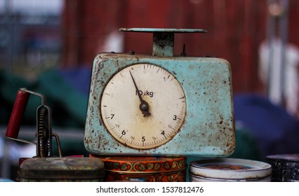 Vintage Antique Metal Blue Food Scale In Flea Market Sitting On Colorful Cans