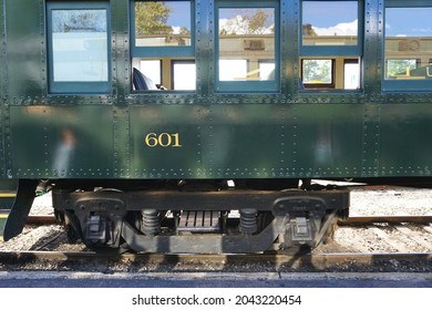 Vintage Antique Train Car With Faded Green Paint And Windows Across The Top Of Image