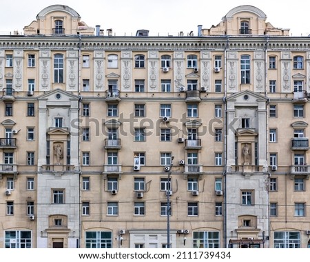 Vintage architecture classical facade old residential building in Soviet Stalin Empire style front view isolated on white