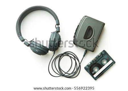 Vintage audio player, audio tape and headphones isolated on white background.