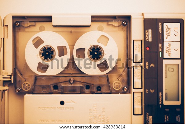 vintage audio tape compact cassette, sepia tone\
with artistic film\
noise