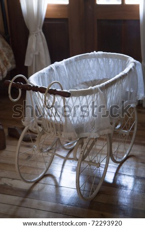 Vintage baby carriage in a room