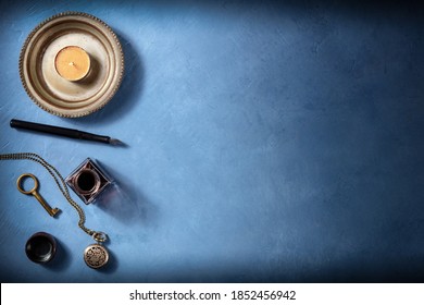 Vintage Background With Copy Space, With An Old Watch, A Key, Ink Well And Pen, And A Candle, A Flat Lay