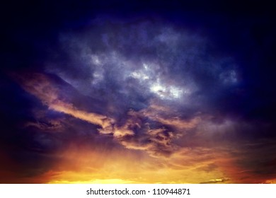 Vintage background of dramatically illuminated stormy clouds