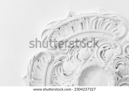 Vintage background photo with a white stucco ceiling plafond, classical architecture elements
