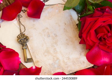 vintage background with red rose petals and antique skeleton key - Powered by Shutterstock