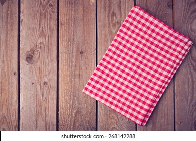 Vintage Background With Tablecloth On Wooden Table. View From Above