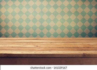 Vintage Background With Wooden Deck Table Over Retro Wallpaper