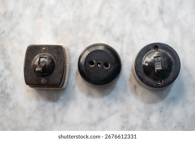 Vintage Bakelite wall switch and socket set — retro rotary light switches and outlet