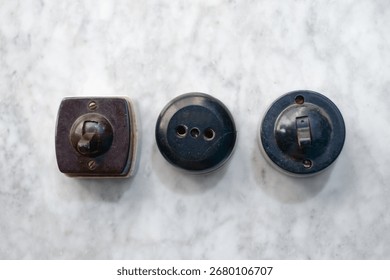 Vintage Bakelite wall switch and socket set — retro rotary light switches and outlet