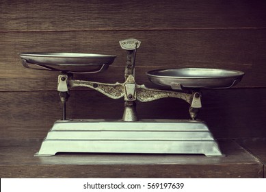Vintage balance on wood background