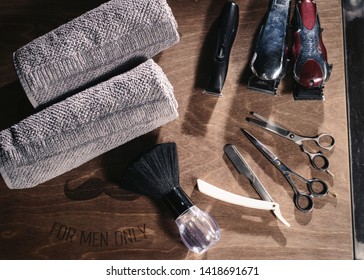 Vintage barber shop hairdresser tools equipment on old wooden background