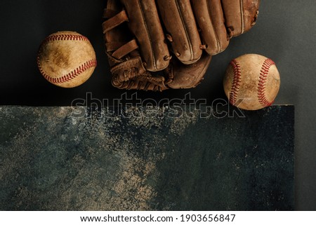Vintage baseball flat lay with copy space on texture background.