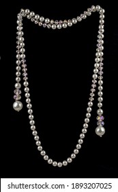 Vintage beads of crystal and pearls on a black background