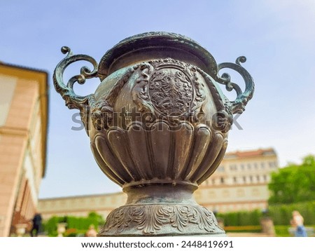 Vintage beautiful bronze vase in the park for Wallenstein gardens in Prague,