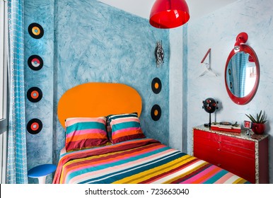 Vintage Bedroom With A 60s Clock, Desk, Records,mirror, Colorful Bedcover And Retro Lamp