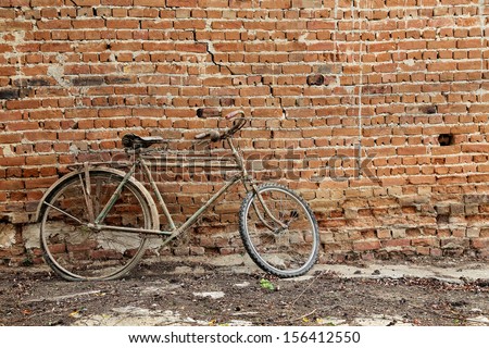 vintage bicycle against old brick wall